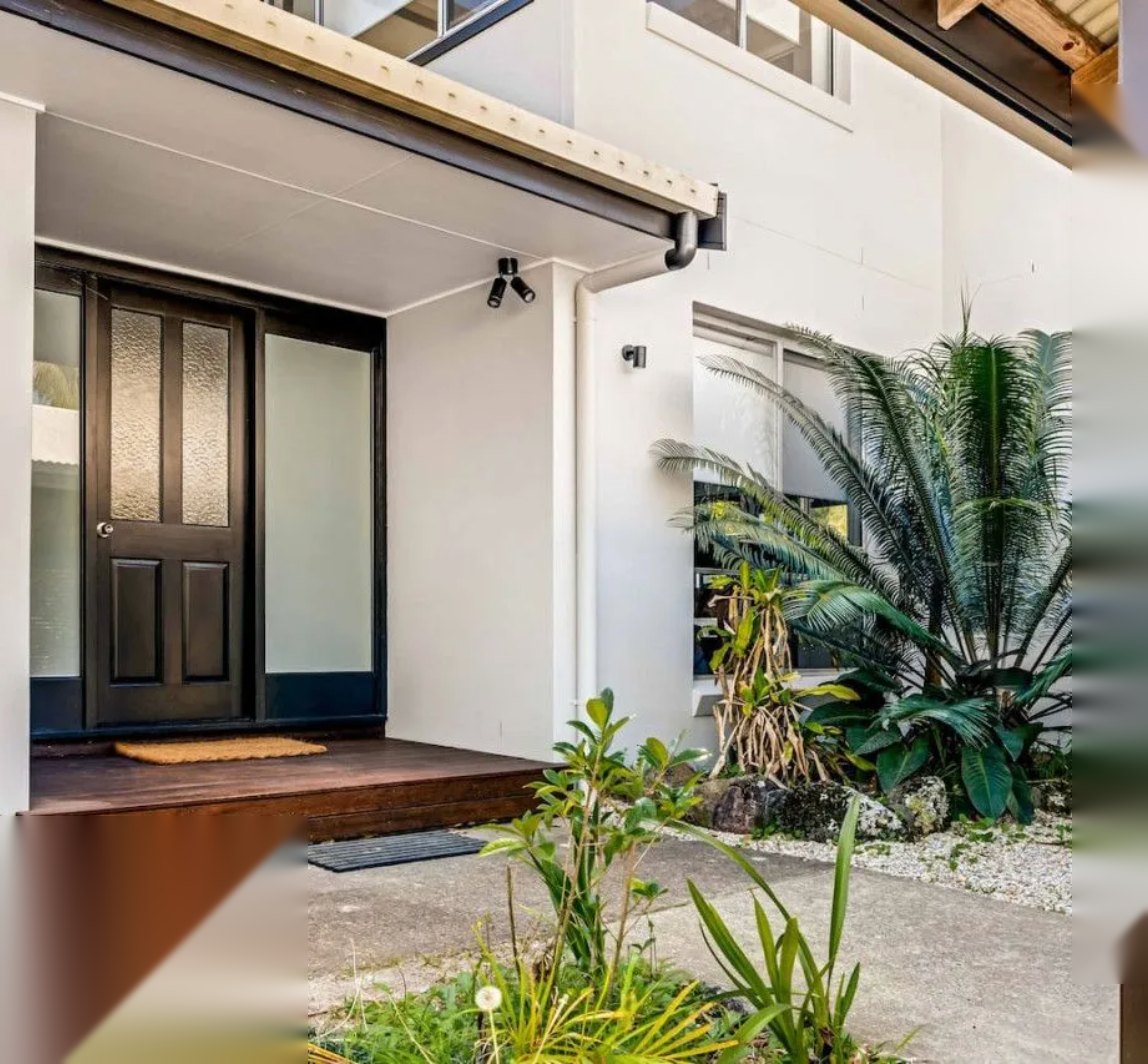 Front entrance of a modern coastal home managed by Intrepid BnB Hosts