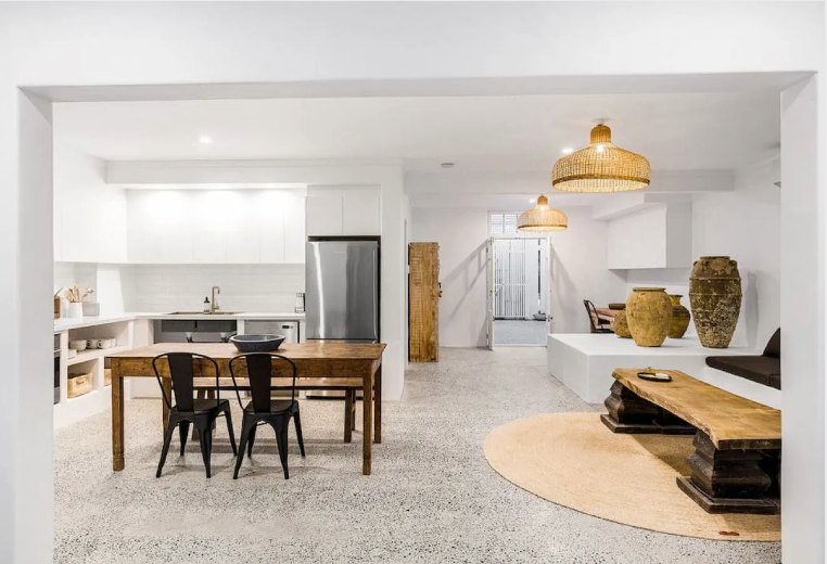 Modern kitchen and dining space with pendant lighting